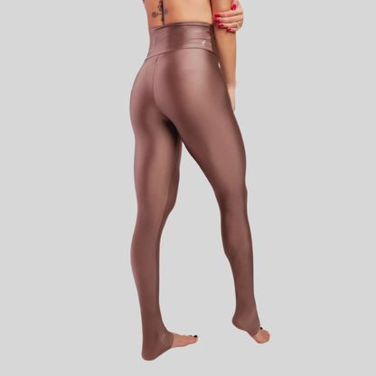 Brown leggings worn by a person on a light gray background