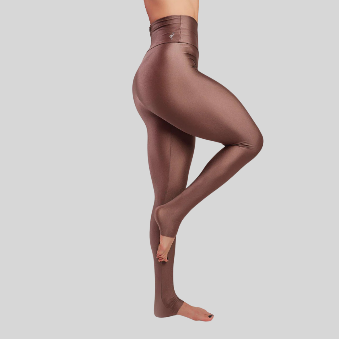 Brown leggings worn by a person on a light gray background