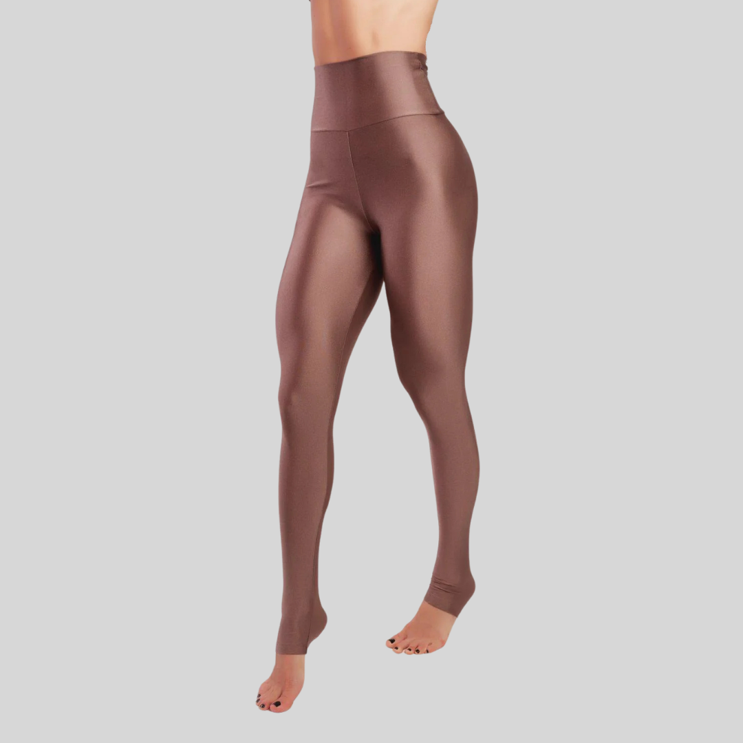 Brown leggings worn by a person on a gray background