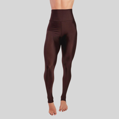 Brown leggings worn by a person on a gray background